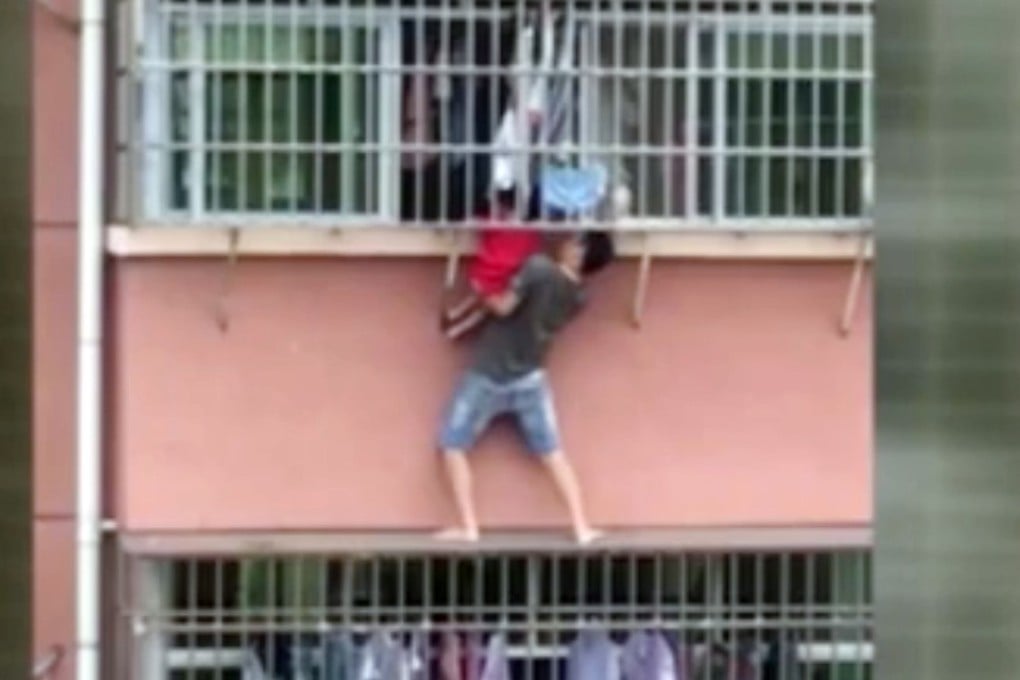 With little to hang on to, the neighbour lifted the boy through the window grille. Photo: Handout