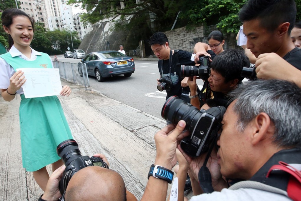 Top scorer Angela Sze Yik-yan poses for photographers outside Belilios Public School. Photo: David Wong