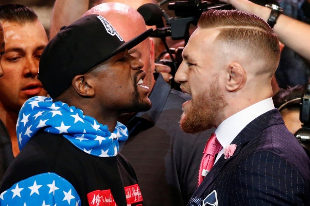Floyd Mayweather (left) and Conor McGregor square off. Photo: Reuters