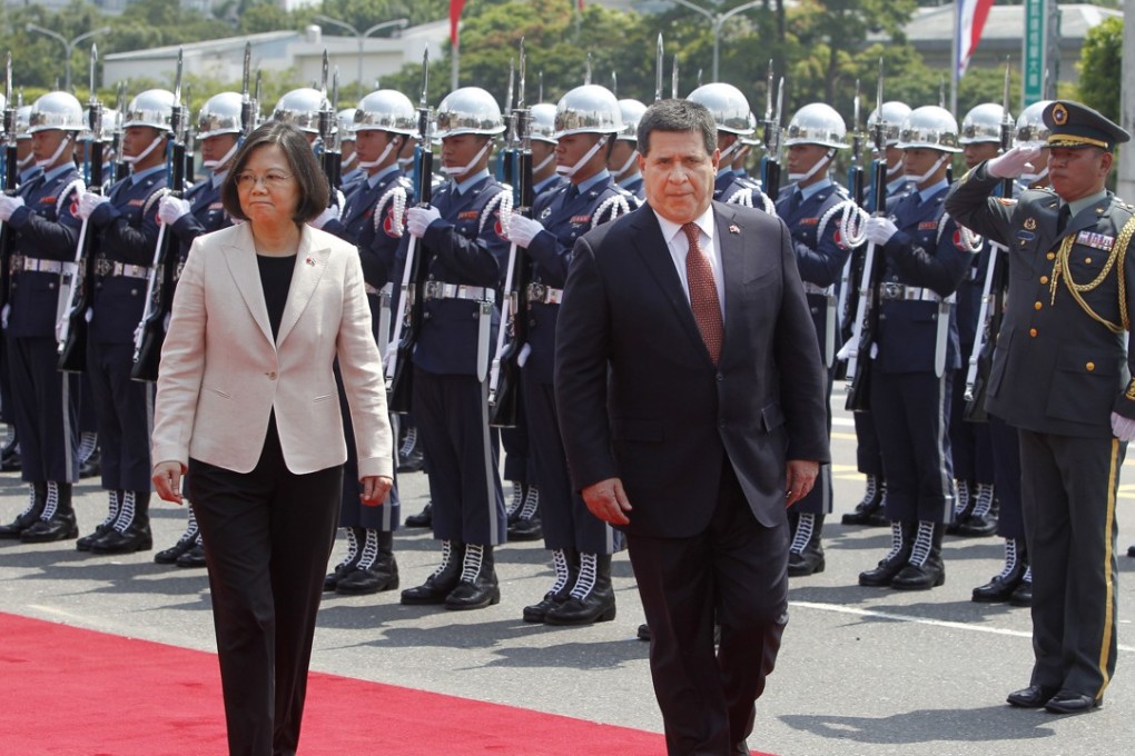 Paraguay's President Horacio Cartes (right) reviews an honour guard with Taiwan's President Tsai Ing-wen in Taipei on Wednesday. Photo: Associated Press