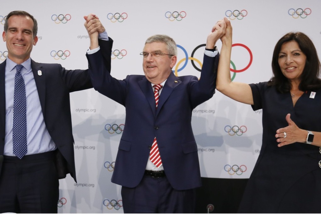 International Olympic Committee president Thomas Bach (centre), mayor of Los Angeles Eric Garcetti (left) and mayor of Paris Anne Hidalgo. Photo: Reuters