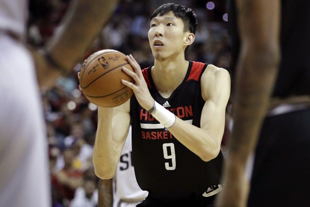 Houston Rockets' Zhou Qi shoots a free throw against the Phoenix Suns in the NBA summer league. Photos: AP