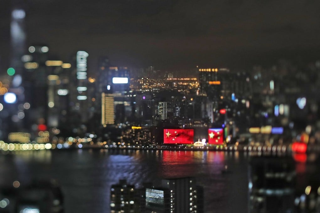 The Chinese national flag appears on a screen to mark the 20th handover anniversary at Victoria Habour in Hong Kong. Photo: AP