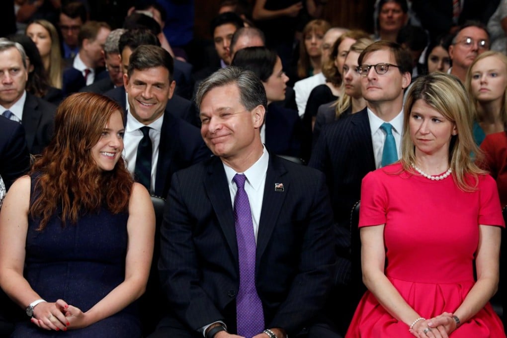 Christopher Wray is seated with his daughter Caroline (left) as he prepares to testify before a Senate Judiciary Committee confirmation hearing on his nomination to be the next FBI director on Capitol Hill in Washington on Wednesday. Photo: Reuters