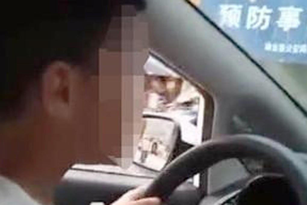 A six-year-old boy was filmed steering a car through the streets of a southern China city. Photo: Handout