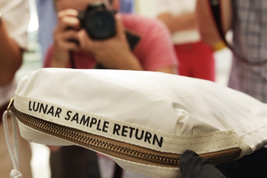 The Apollo 11 Contingency Lunar Sample Return Bag used by astronaut Neil Armstrong, to be offered at auction, is displayed at Sotheby's, in New York, on Thursday, July 13, 2017. Photo: AP