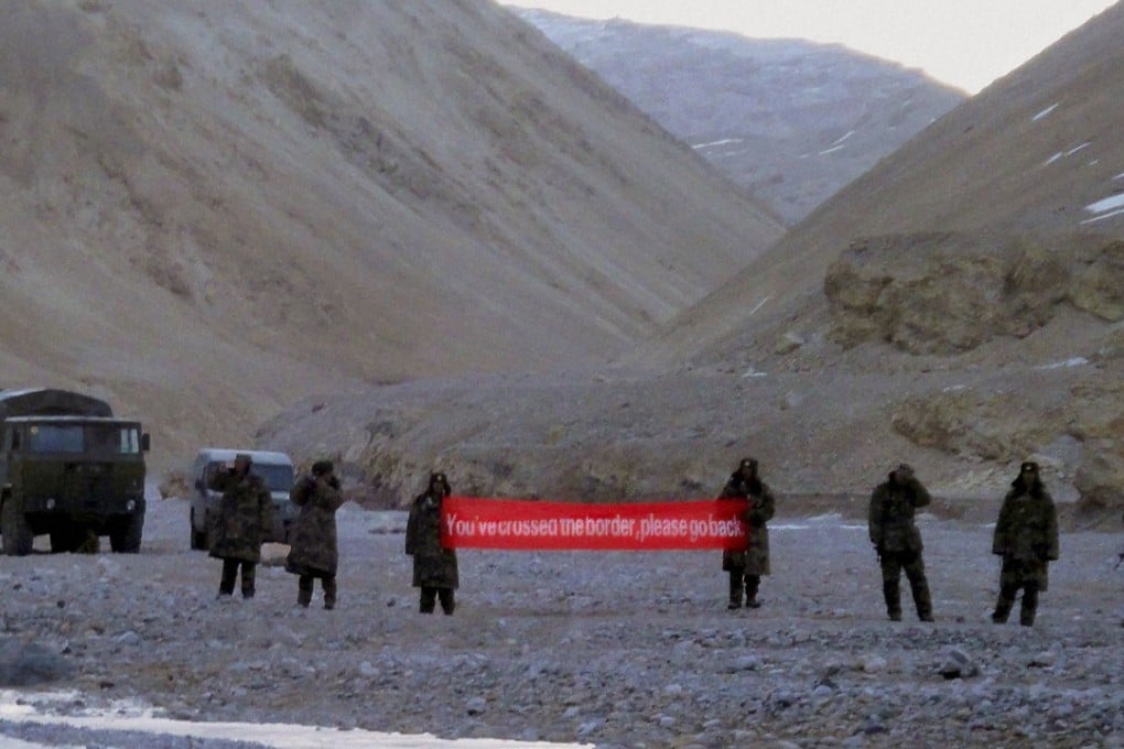 Chinese troops hold a banner which reads “You’ve crossed the border, please go back” in Ladakh, India, in May 2013. Border disputes between the two countries, arguably a result of British colonisation, have simmered for years but recently flared up again. Photo: AP