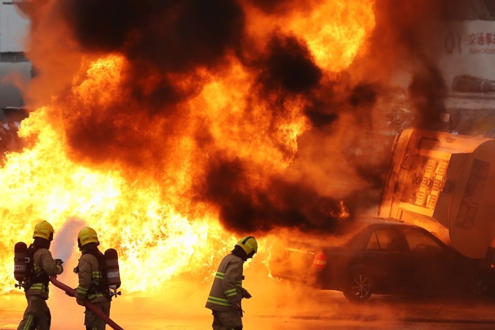 Fireman demonstration: Fuel tank and petrol filling station incident training,during the opening ceremony for the Fire and Ambulance Services Academy (FASA) in Tsung Kwan O. Photo: SCMP/Dickson Lee