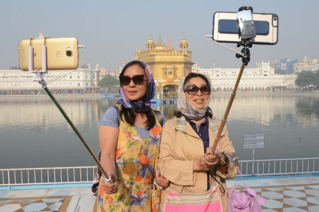 Chinese tourists at the Golden Temple in Amritsar, India. Picture: AFP