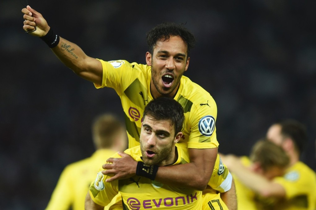 Pierre-Emerick Aubameyang (top) and Sokratis, of Borussia Dortmund. The German club will head to Asia for a preseason tour. Photo: AFP