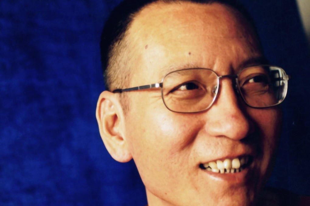 “RIP” and candle emojis were among the Liu Xiaobo tributes censored online in China. Photo: EPA