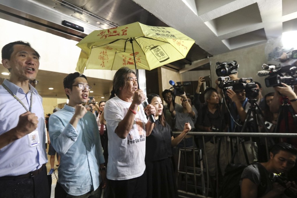 From left: Edward Yiu Chung-yim, Nathan Law Kwun-chung, ‘Long Hair’ Leung Kwok-hung and Lau Siu-lai outside the High Court on Friday. Photo: Felix Wong