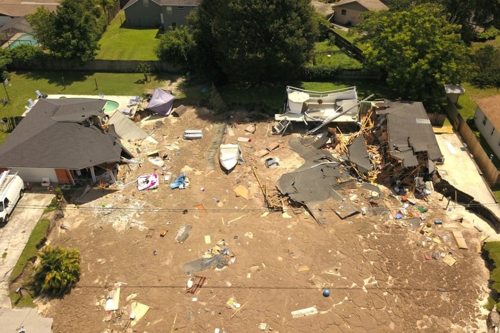 The sinkhole damaged two homes in Land O' Lakes, Florida on Friday, July 14, 2017. Photo: AP