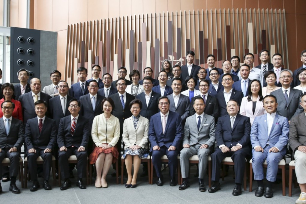 Pro-establishment and pan-democrat lawmakers alike turn out in force at the first luncheon hosted for Chief Executive Carrie Lam (seated, fifth left) and her government team, at Tamar on July 10. Photo: Sam Tsang