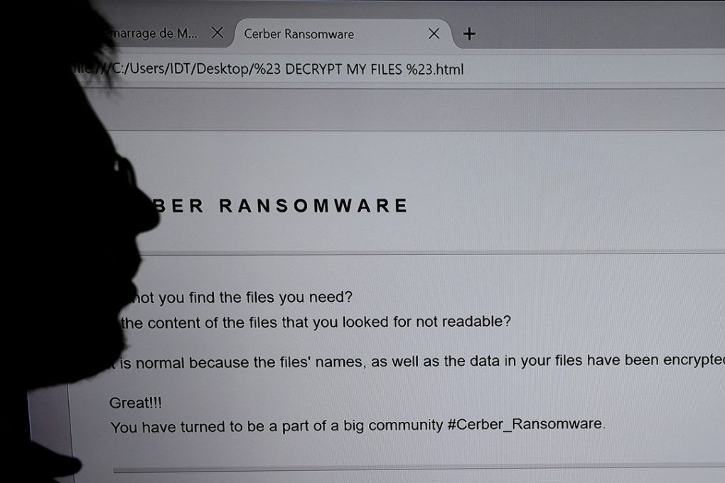 An IT researcher stands next to a giant screen of a computer infected by ransomware at the LHS (High Security Laboratory) of the INRIA (National Institute for Research in Computer Science and Automation) in Rennes, France. Photo: AFP