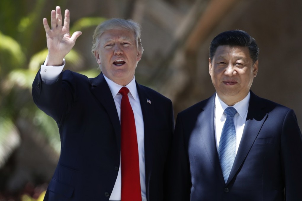 US President Donald Trump and Chinese President Xi Jinping pause for photographs at Mar-a-Lago, in Palm Beach, Florida. Photo: AP