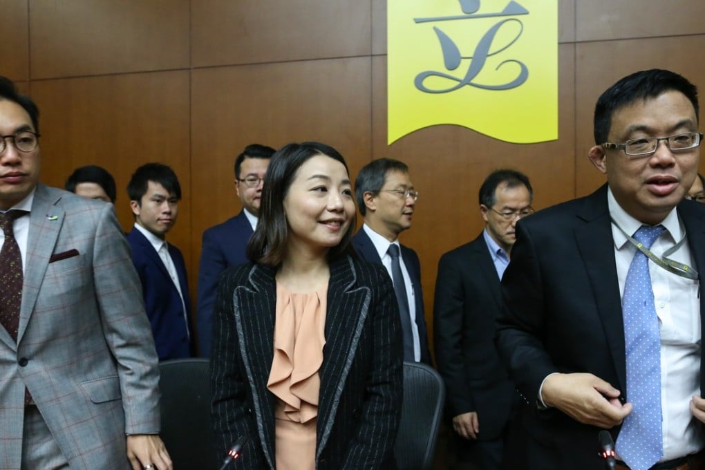 Alvin Yeung (left) and James To flank fellow lawmaker Lau Siu-lai as pro-democracy Legco members hold a press conference at Tamar last November 30. Lau is one of four lawmakers to have been disqualified by a July 14 court ruling. Photo: Dickson Lee