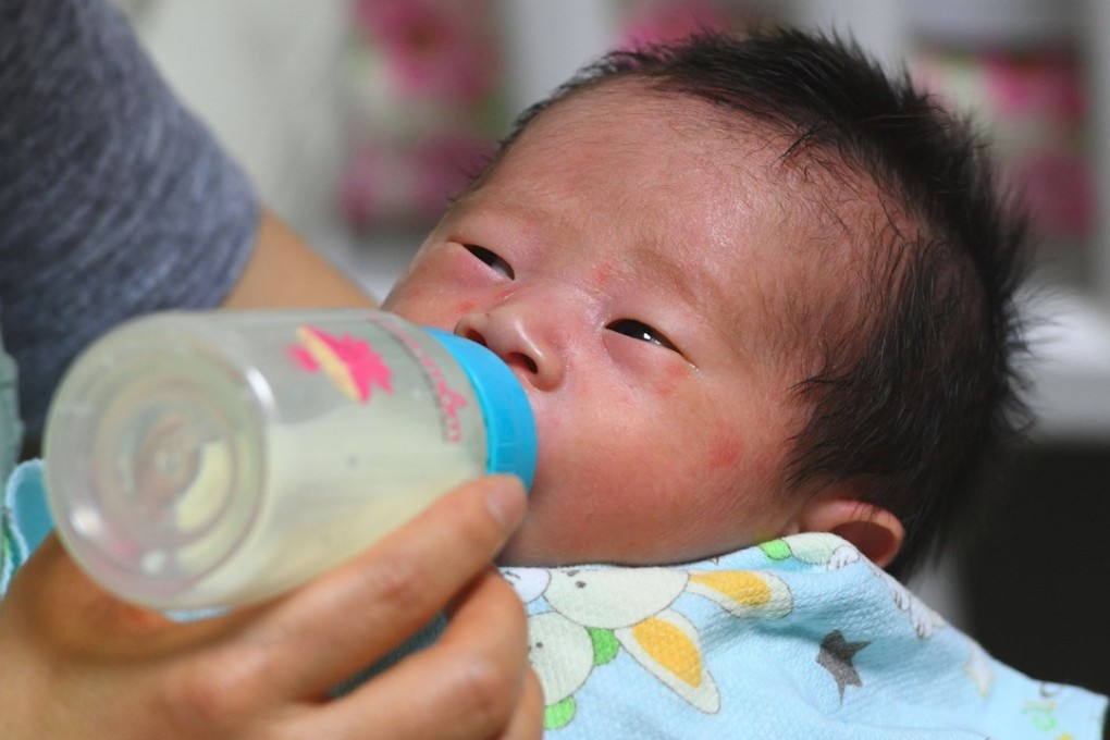Social workers caring for a baby at the Jusarang Community Church in southern Seoul. Photo: AFP