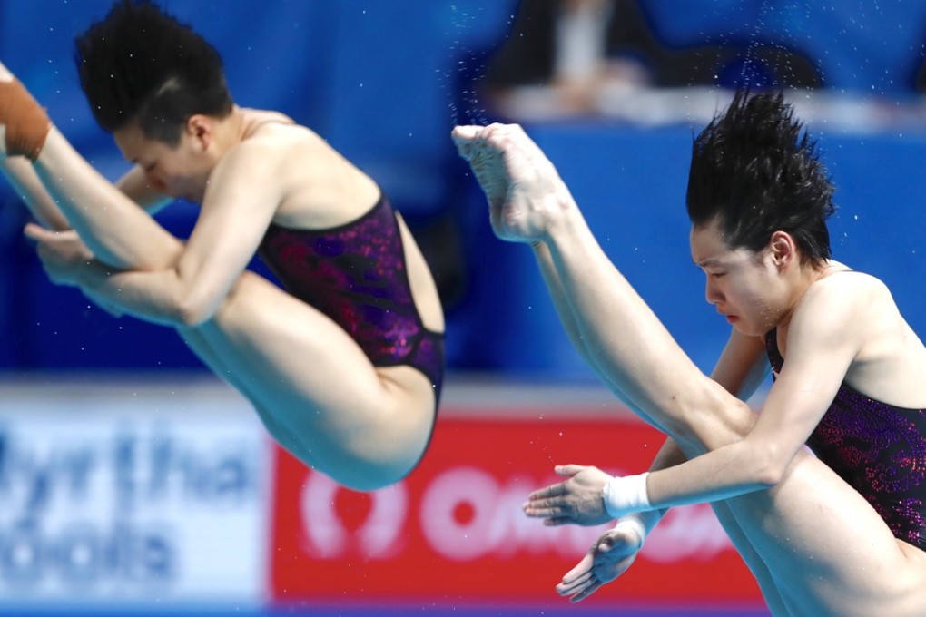 China's Shi Tingmao (left) and Chang Yani on their way to the gold medal. Photo: Xinhua