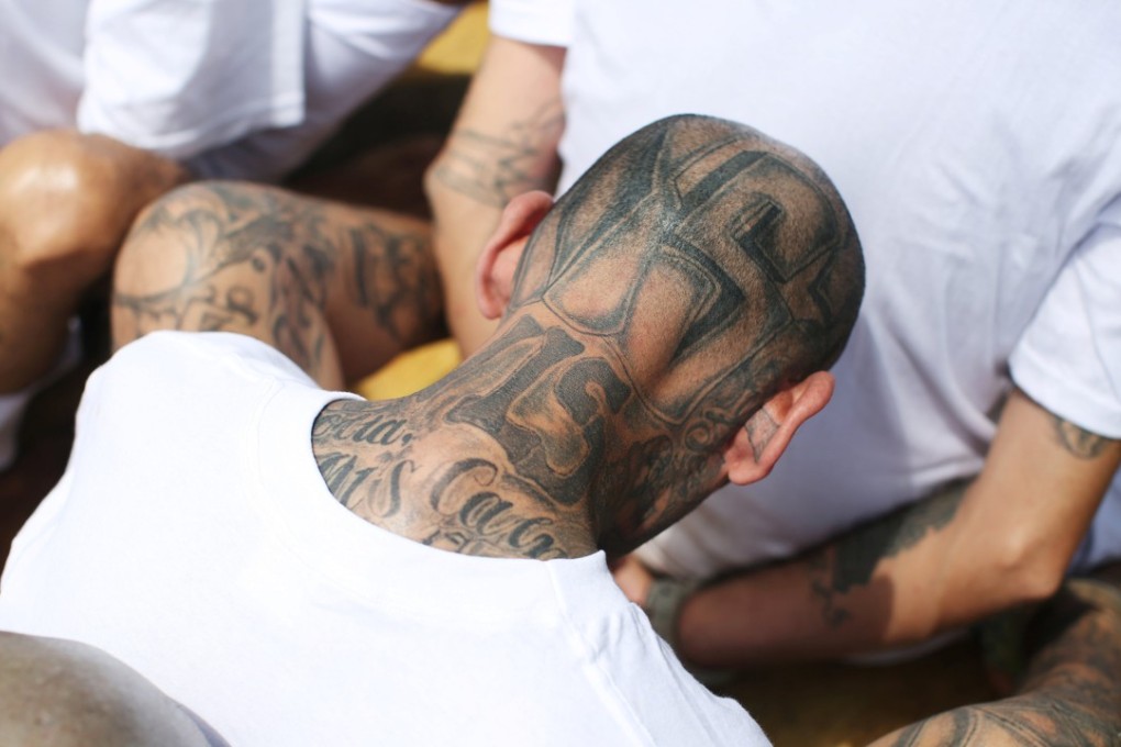 Tattoos identify a prisoner at a maximum-security jail in El Salvador as an MS-13 gang member. Photo: Reuters
