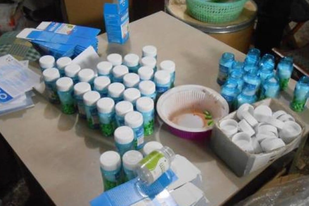 Police found dozens of bottles of illicit drugs during a raid on a workshop in Jiangsu province. Photo: Handout