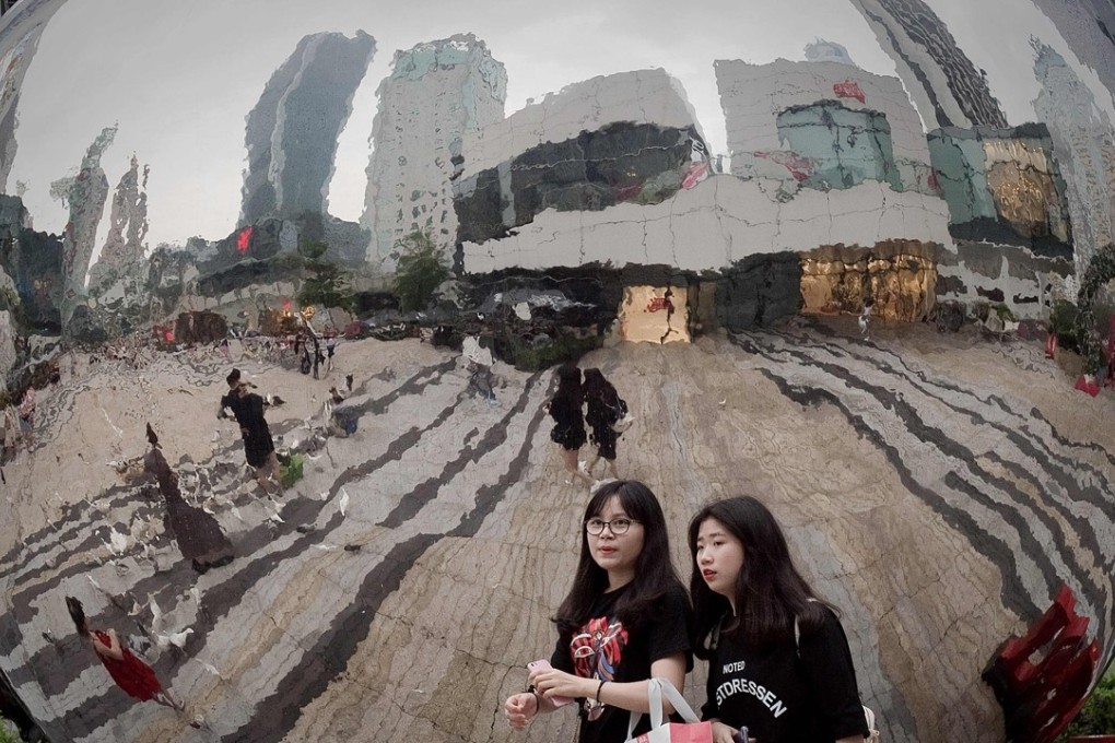Shoppers at a mall in Shenzhen. Beijing fears that China’s breakneck economic growth has led to a build-up of risk. Photo: AFP