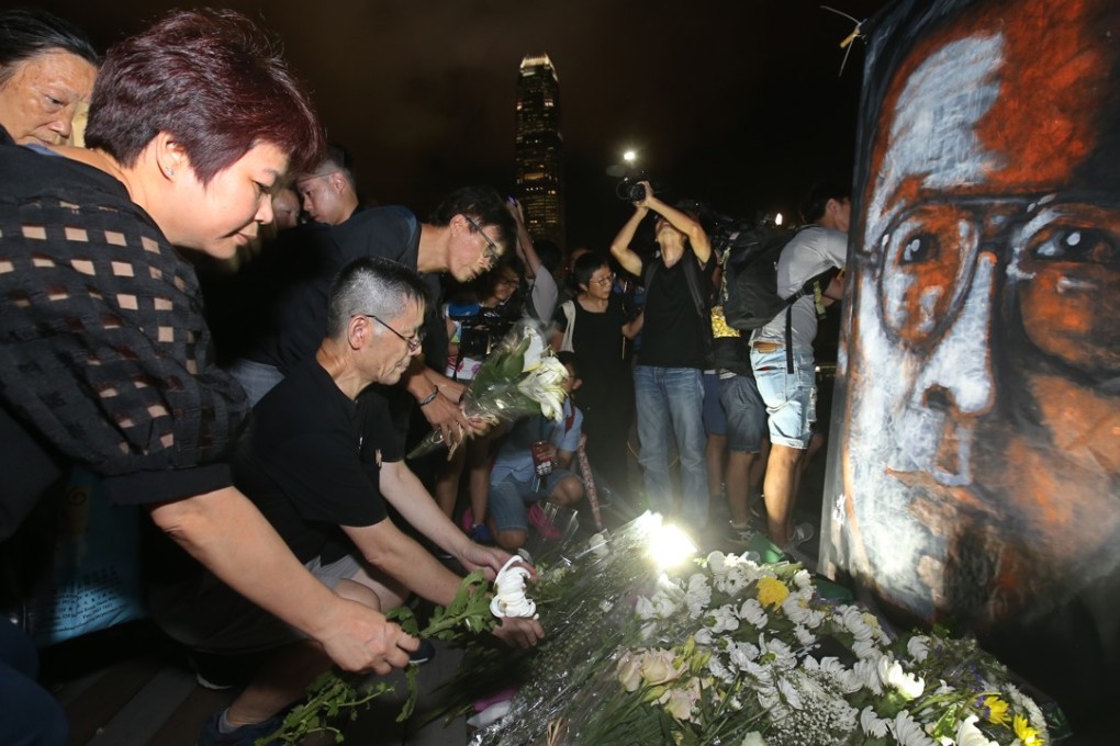 Mourners attend the memorial service for Liu Xiaobo at Tamar Park. Photo: K. Y. Cheng