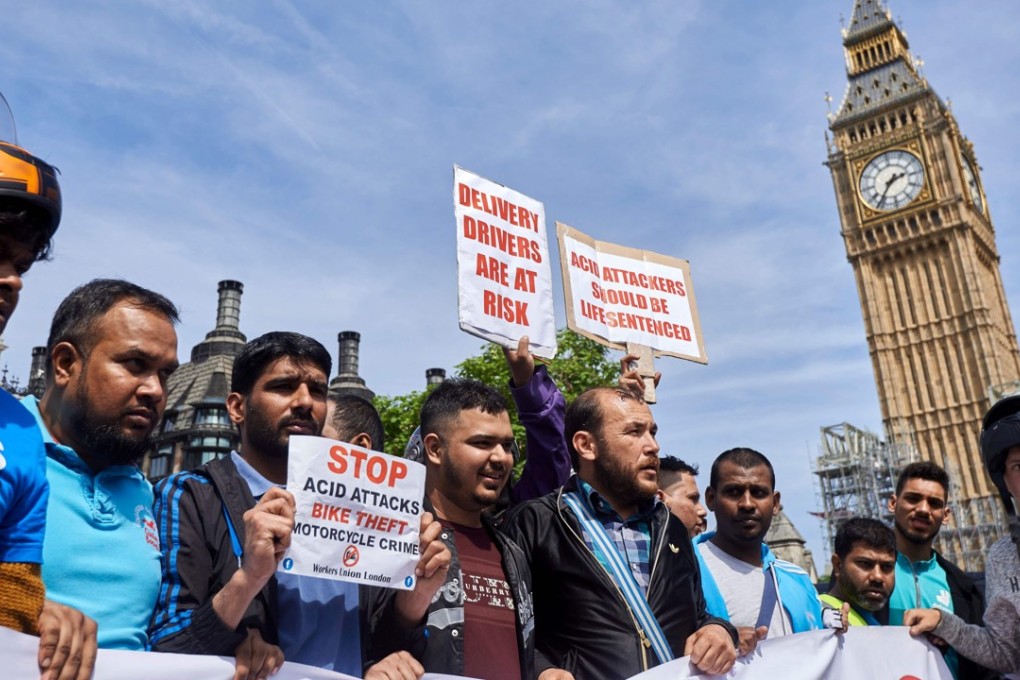 Delivery drivers take part in a demonstration in Parliament Square in central London on Tuesday, in the wake of a spate of acid attacks. Photo: AFP