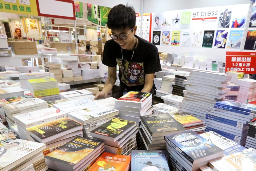 A worker prepares a display at the exhibition centre for the annual fair, which has attracted 670 exhibitors from 37 countries. Photo: Felix Wong