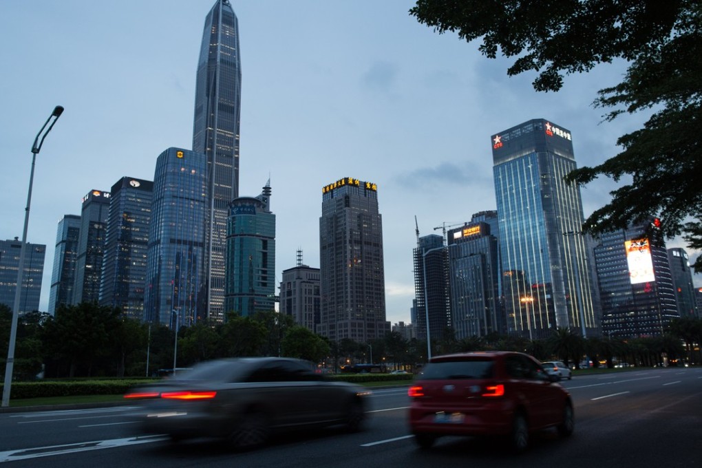epa06042264 Cars drive past commercial buildings in the business district of Shenzhen, China, 21 June 2017 (issued 22 June 2017). Shenzhen, just north of Hong Kong, is part of China's urbanization push called the Guangdong-Hong Kong-Macau Greater Bay Area. It encompasses 11 cities including Hong Kong, Macao, Guangzhou, Shenzhen, Zhuhai, Foshan, Zhongshan, Dongguan, Huizhou, Jiangmen and Zhaoqing. The combined GDP of China's 56,500 square kilometer Bay Area reached 1.36 trillion US dollars in 2016, with an estimated population of 66.71 million. EPA/STR