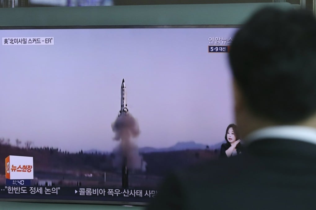A man watches a TV news report about North Korea’s missile firing in Seoul. Photo: AP