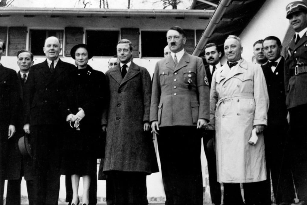 The former King Edward VIII (centre left) with Adolf Hitler (centre right) and Nazi officials in the Bavarian alps in 1937. By Edward's side is his American wife, Wallis Simpson. Photo: AP