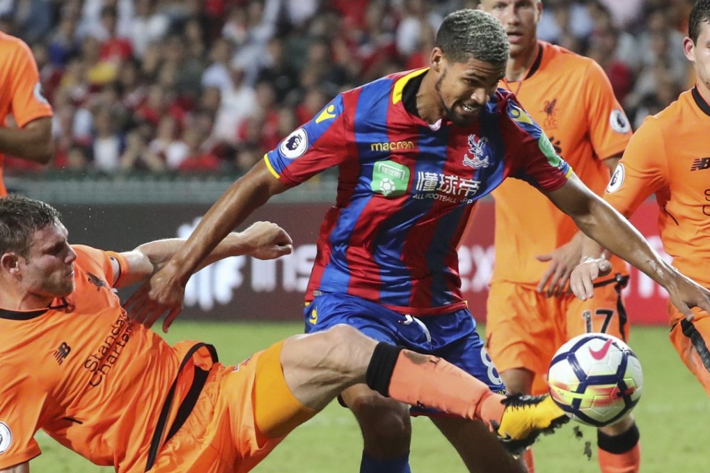 Crystal Palace’s Ruben Loftus-Cheek tries to avoid a tackle from Liverpool’s James Milner. Photos: Edward Wong