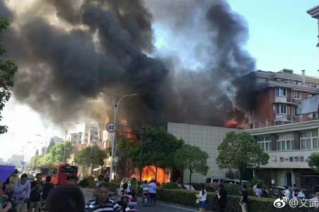 Flames pouring from the building in Hangzhou. Photo: Handout