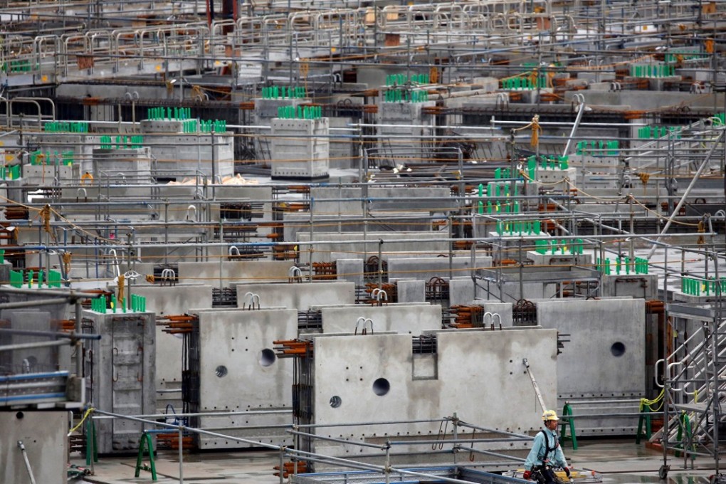File photo of a worker at the site of the Tokyo’s new national stadium. Photo: Reuters