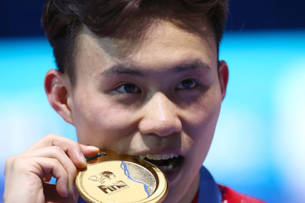 Siyi Xie poses with his gold medal in Budapest Photo: Reuters