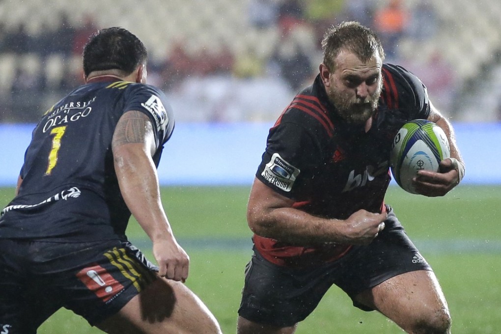 Crusaders’ prop Joe Moody surges forward against the Highlanders. Photos: AP