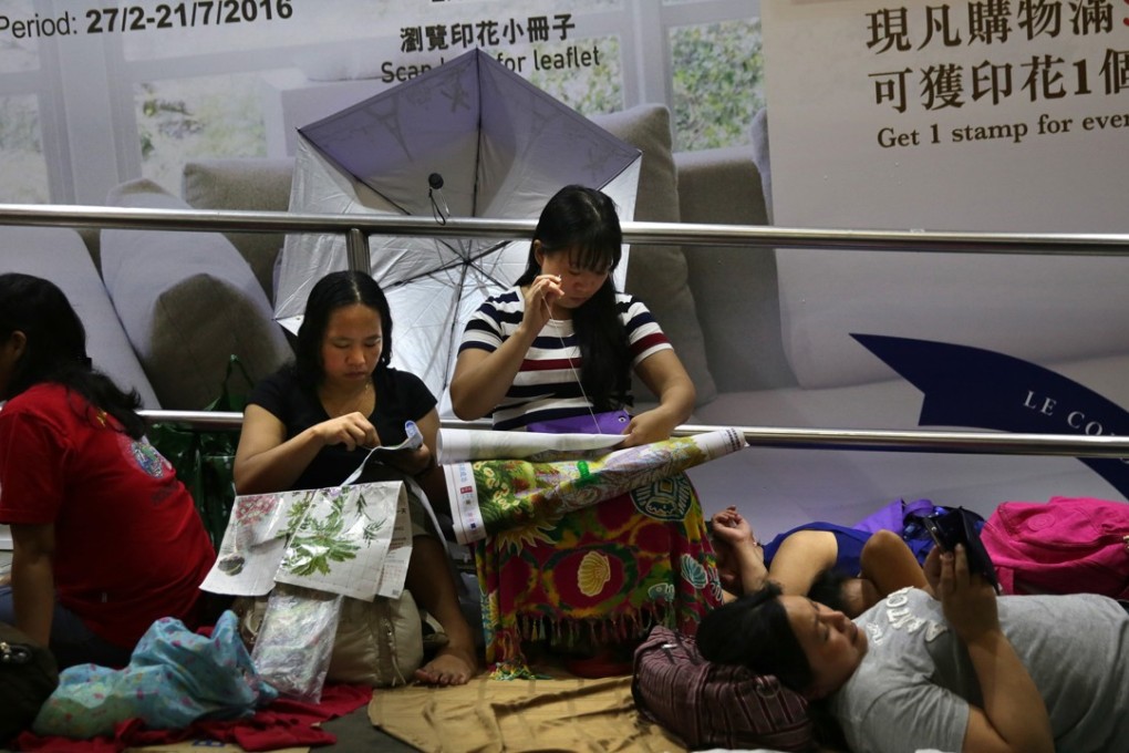 A domestic helper has sought a review of the rule that requires maids to live with their employers. However allowing them to live out would also raise a number of difficult issues. Photo: AFP