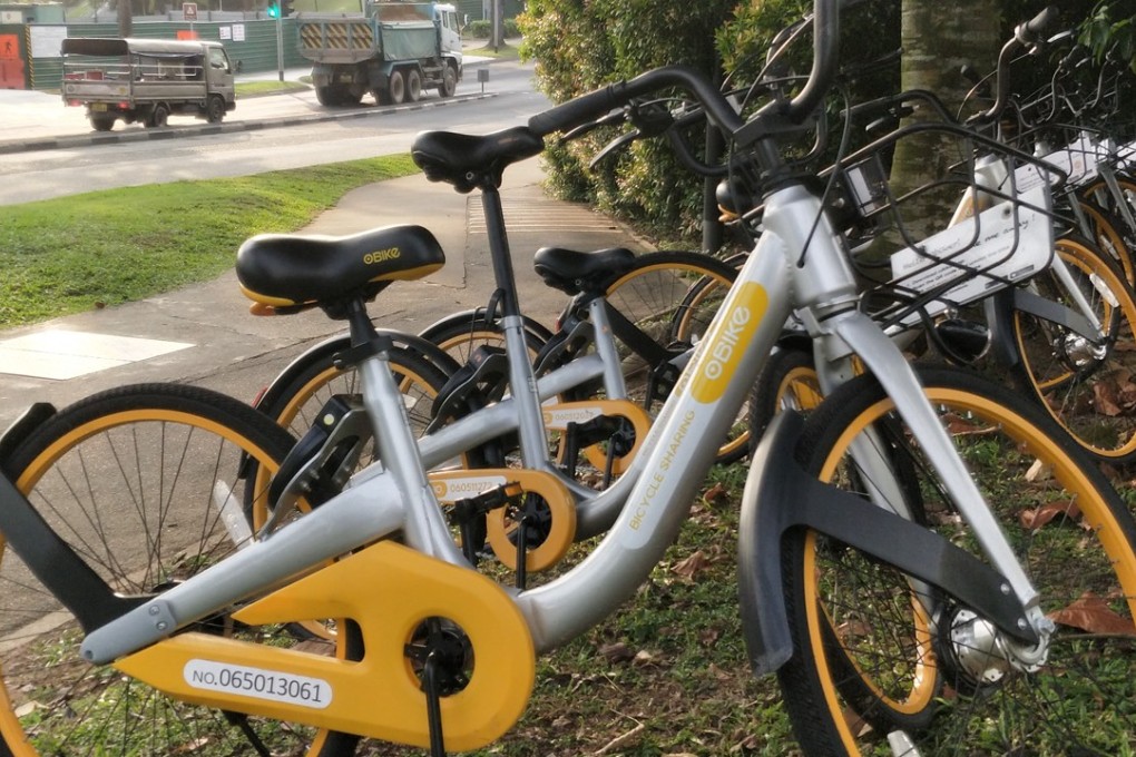 Tiny Singapore bikes sit waiting to be picked up by riders. Photo: Handout