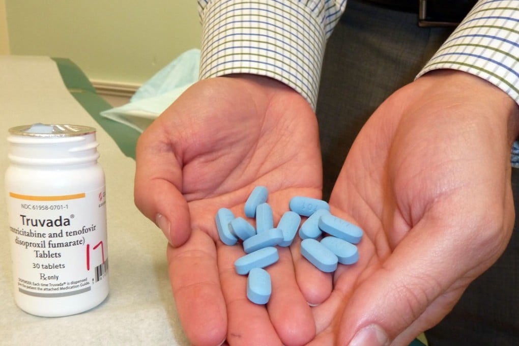 Dr Ray Martins, of the Whitman-Walker Clinic in Washington, holds a handful of Truvada, the first pill recommended for HIV prevention. Photo: AFP
