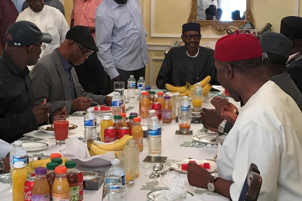 Nigeria’s President Muhammadu Buhari (in black, centre). Photo: Reuters