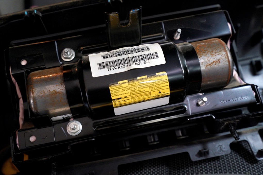 A recalled Takata airbag inflator before being removed from a Jeep in the US. Photo: Reuters