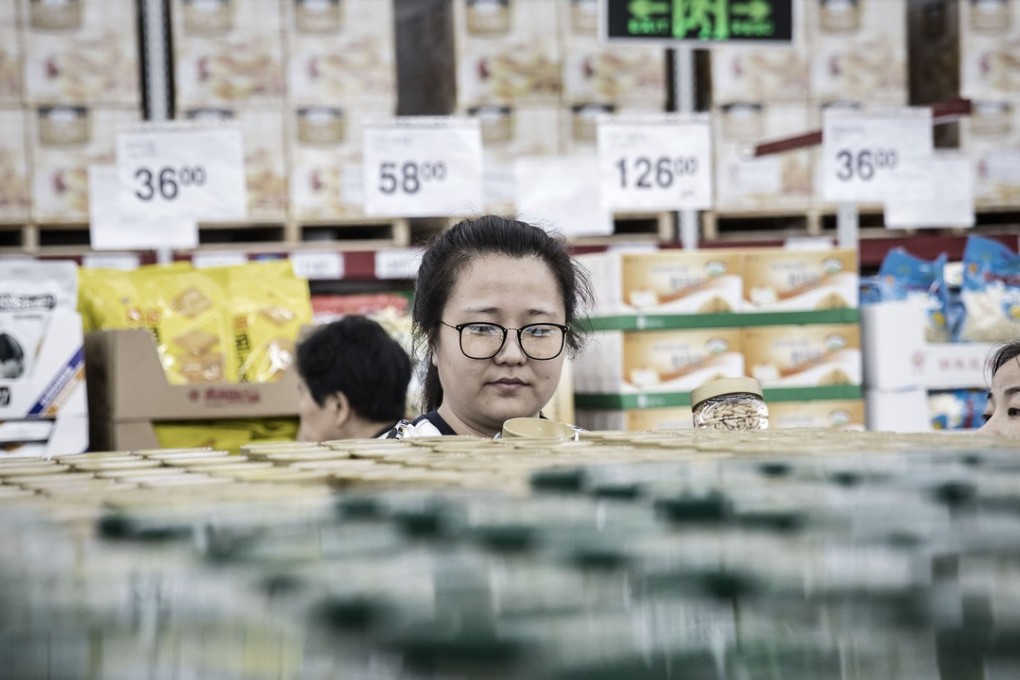 Customers browse items in a Wal-Mart Store during its opening day in Tianjin last year. Photo: Bloomberg