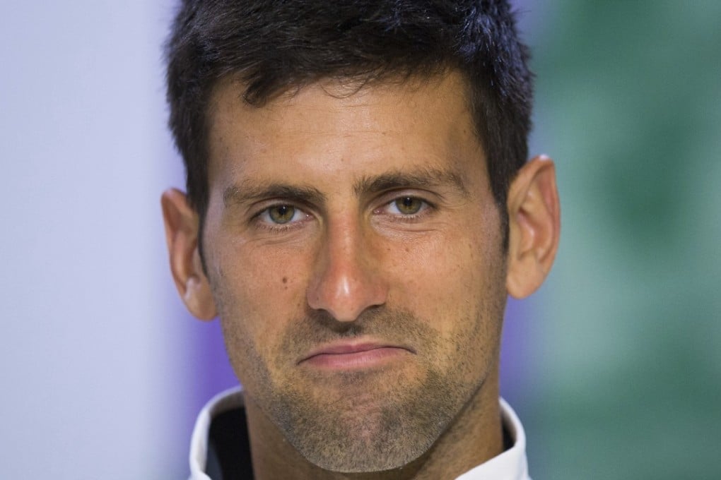 Novak Djokovic is considering a break from tennis to allow his injured elbow to mend. Photo: AP