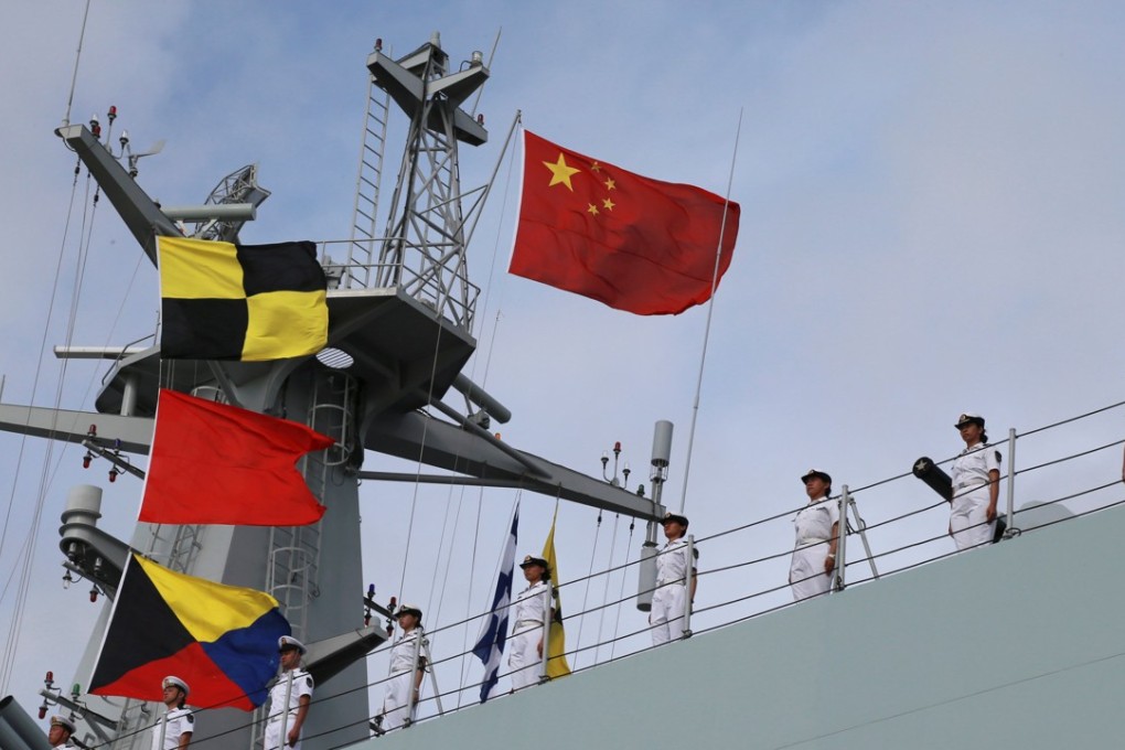 Soldiers of China’s People's Liberation Army stand on a ship sailing off from a military port in Zhanjiang, Guangdong province. Photo: Reuters