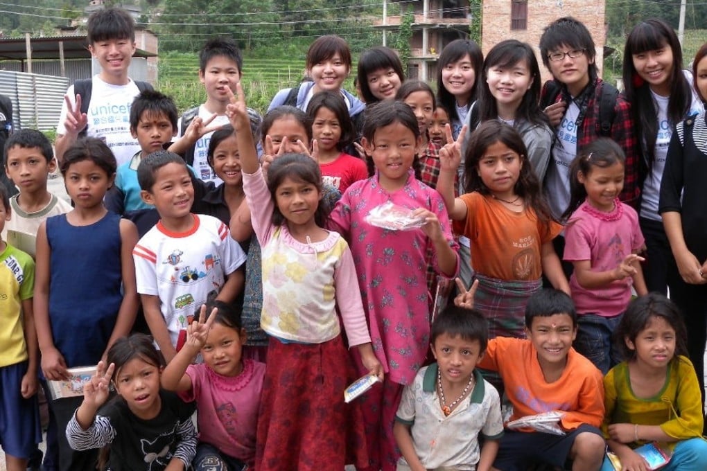 Teenage volunteer teachers from Hong Kong with children they taught in Nepal. Photo: Mabel Sieh