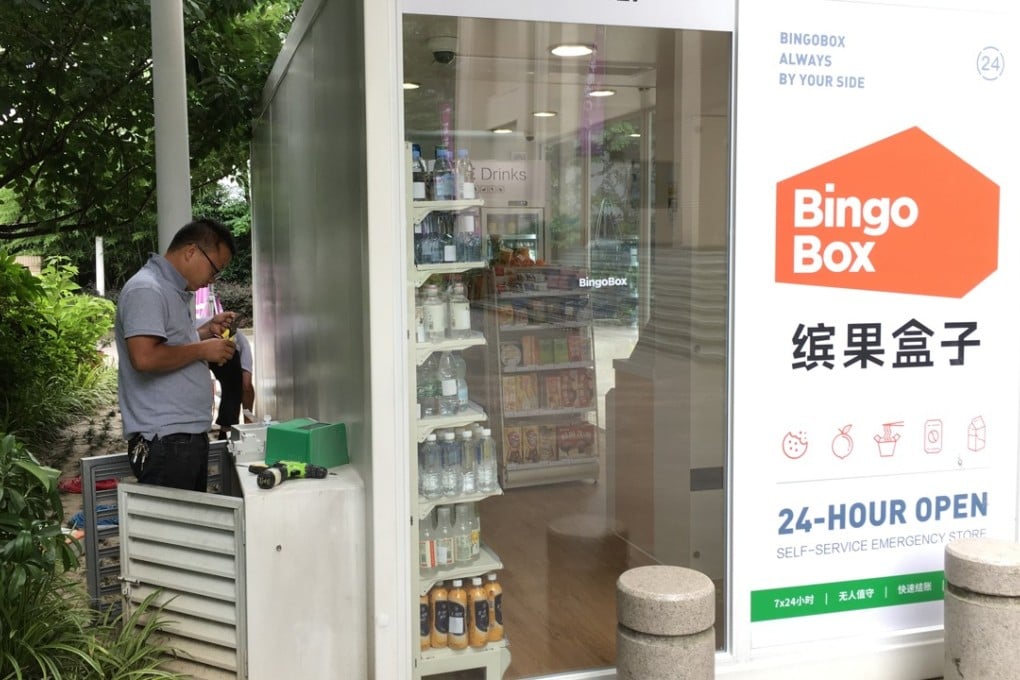 A worker installs an air conditioner at a BingoBox unmanned store, one of a dozen under trial operation on the mainland. Photo: Handout