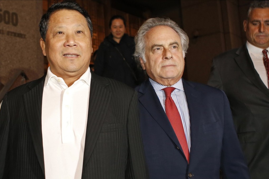 In this October 26, 2015, file photo, Macau billionaire Ng Lap-seng, left, leaves federal court with his attorney Ben Brafman after he was released on bail in connection with an alleged UN bribery scheme in New York. Photo: AP