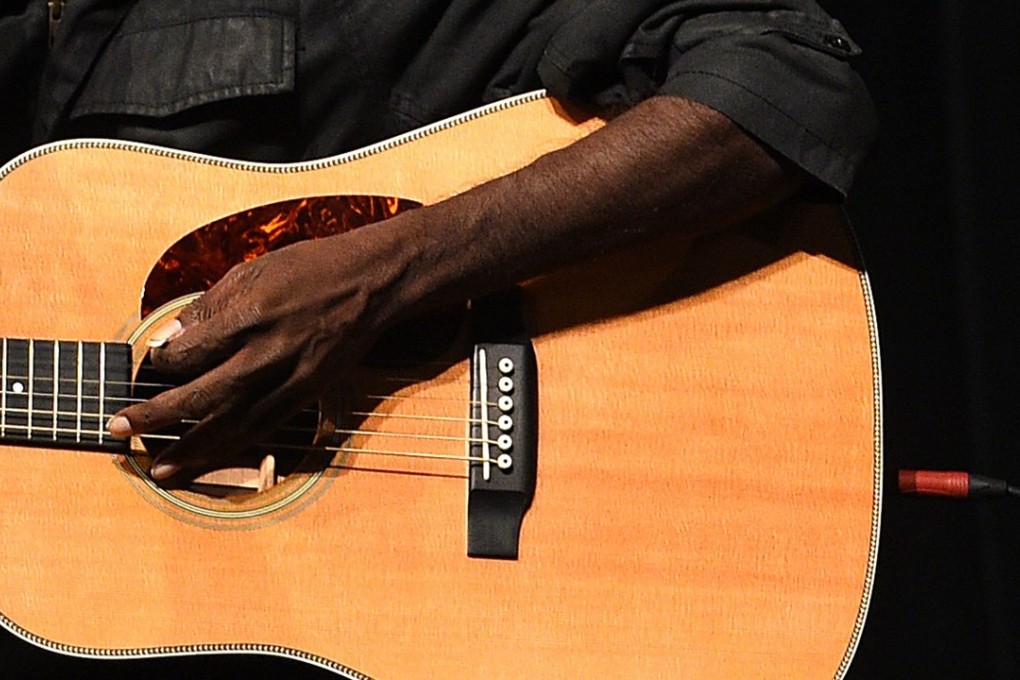 Australia's most prominent indigenous musician, Dr G Yunupingu, performs in 2015. Under Aboriginal custom, the publication of images of a recently deceased person is prohibited. Photo: EPA