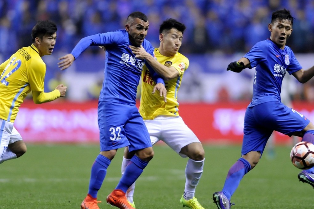 Shanghai Shenhua's Argentine striker Carlos Tevez (centre) is the highest-paid player in the Chinese Super League. Photo: AFP